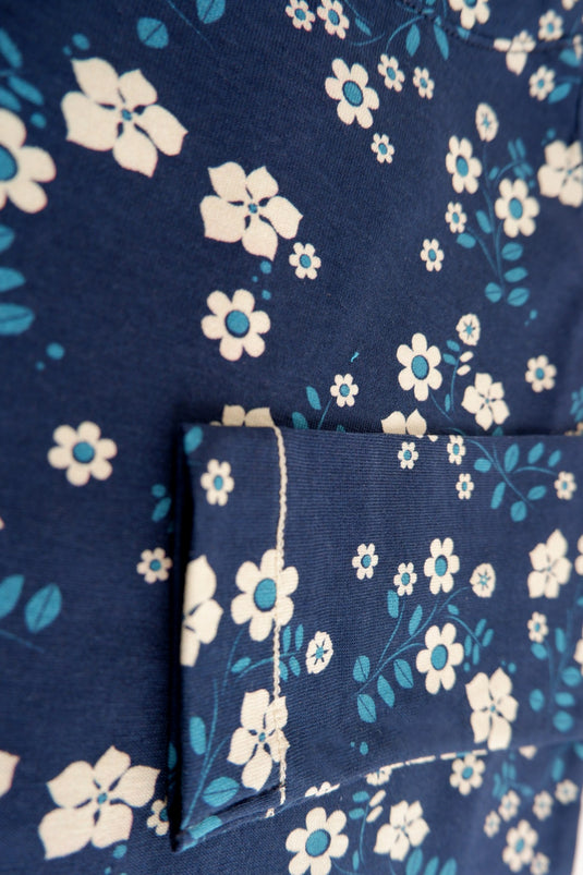 Detail of Organic t-shirt with long arms in dark blue with white flowers for kids