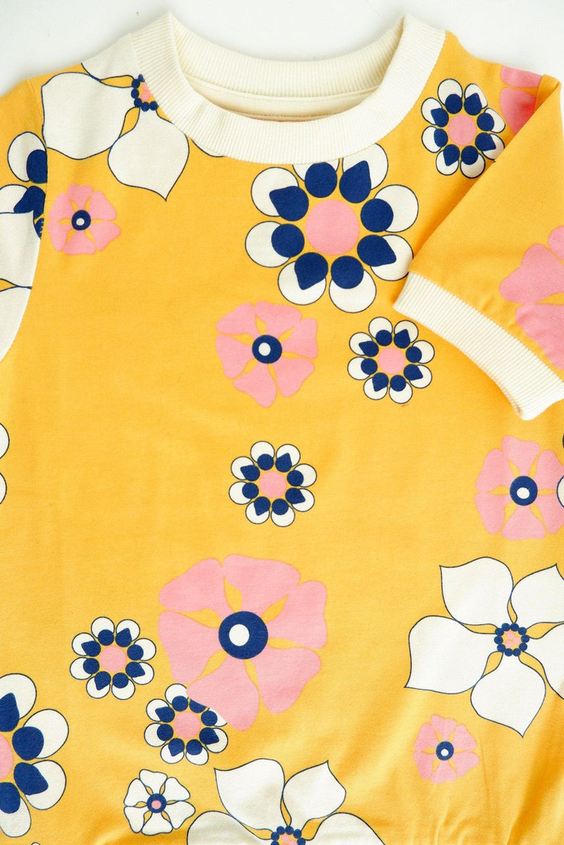 Load image into Gallery viewer, front detail of Organic and retro T-shirt, comfy and soft, with lots of flowers
