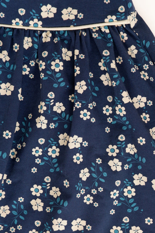 Detail of Organic cotton skirt in dark blue with small white flowers for girls