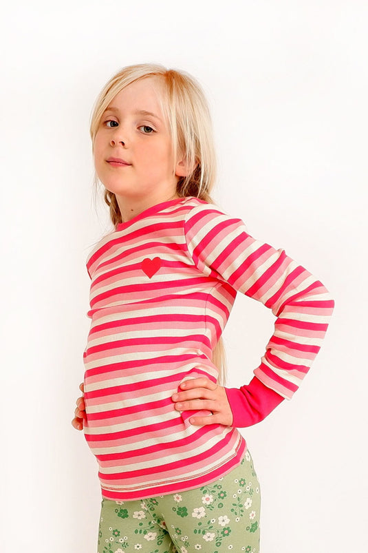 Scandinavian girl wearing striped pink blouse Albababy