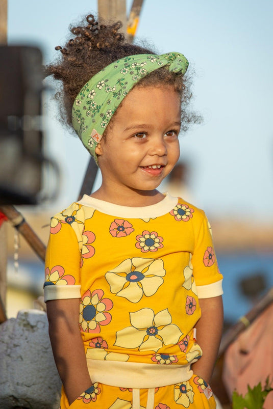 girl wearing I AM a flower dream. Sun Yellow, made with organic cotton