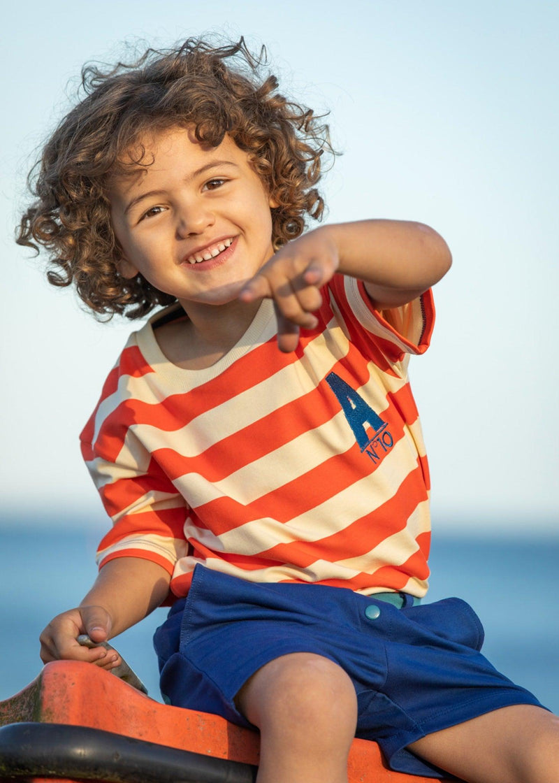Load image into Gallery viewer, Child wearing Organic t-shirt in red breton stripe for children by albaofdenmark
