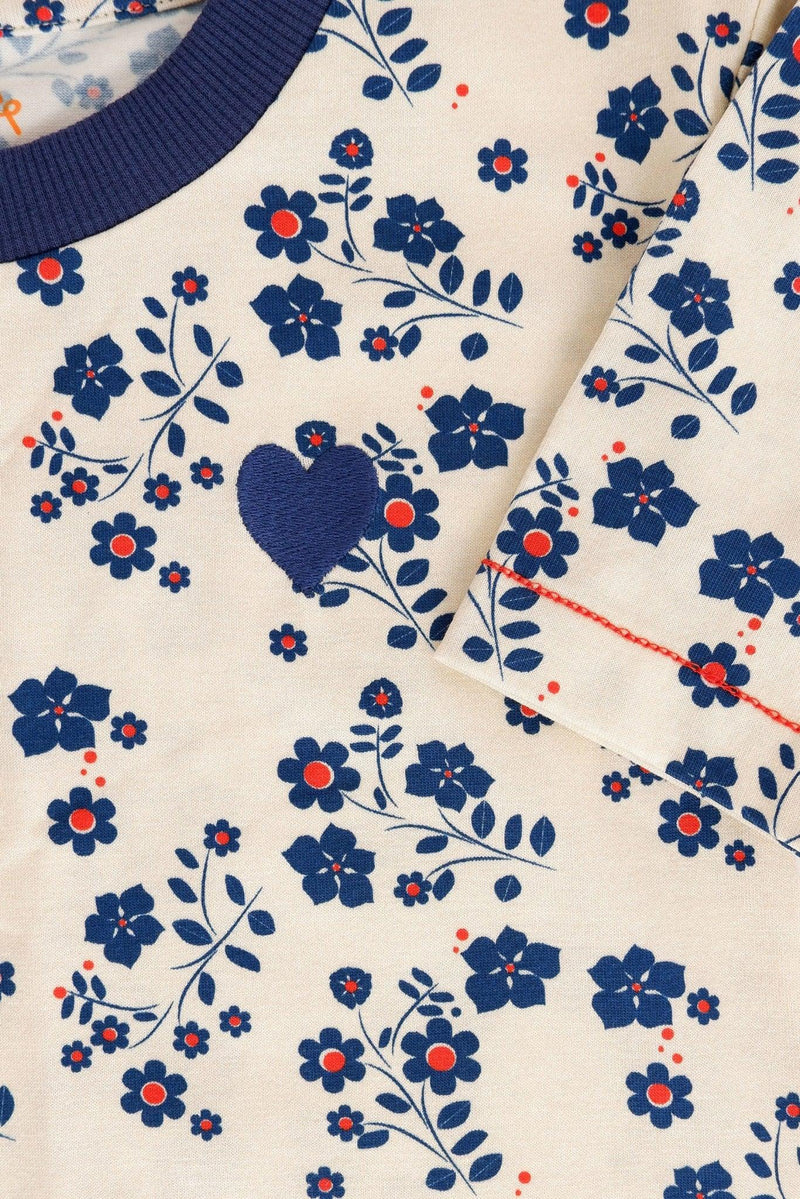 Load image into Gallery viewer, Chest detail of vida dress in white with small blue strawberry flowers by albaofdenmark
