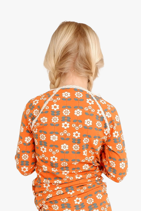 retro orange blouse with small white flowers in organic cotton for babies