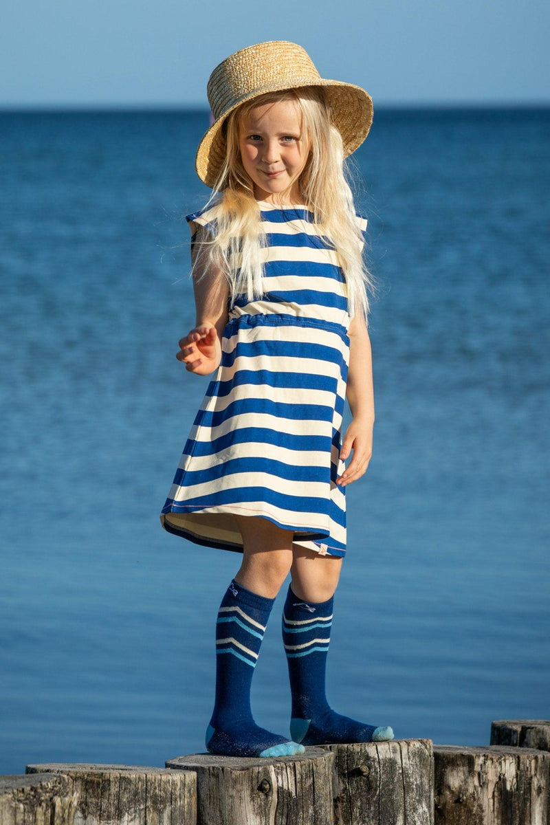 Load image into Gallery viewer, girl wearing breton stripe blue and white in organic fabric by albaofdenmark
