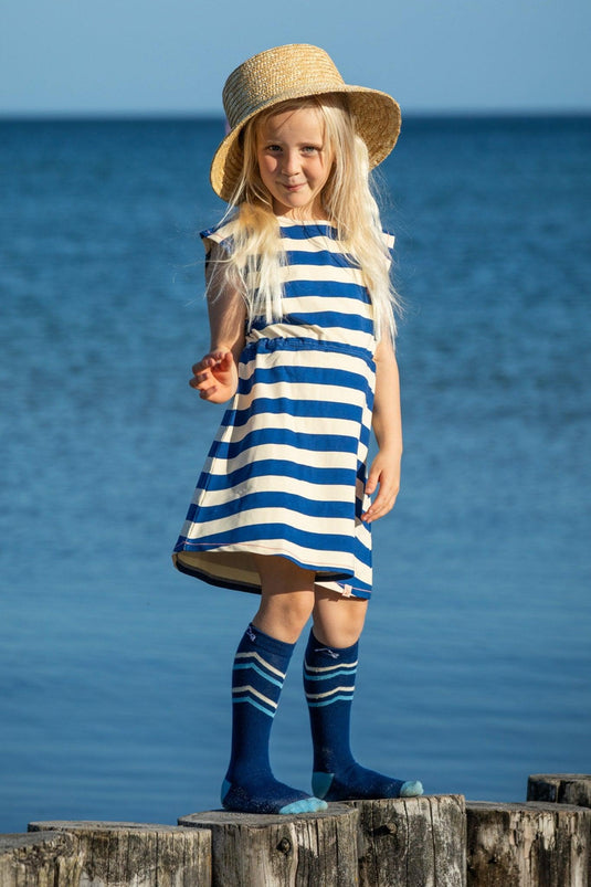 girl wearing breton stripe blue and white in organic fabric by albaofdenmark