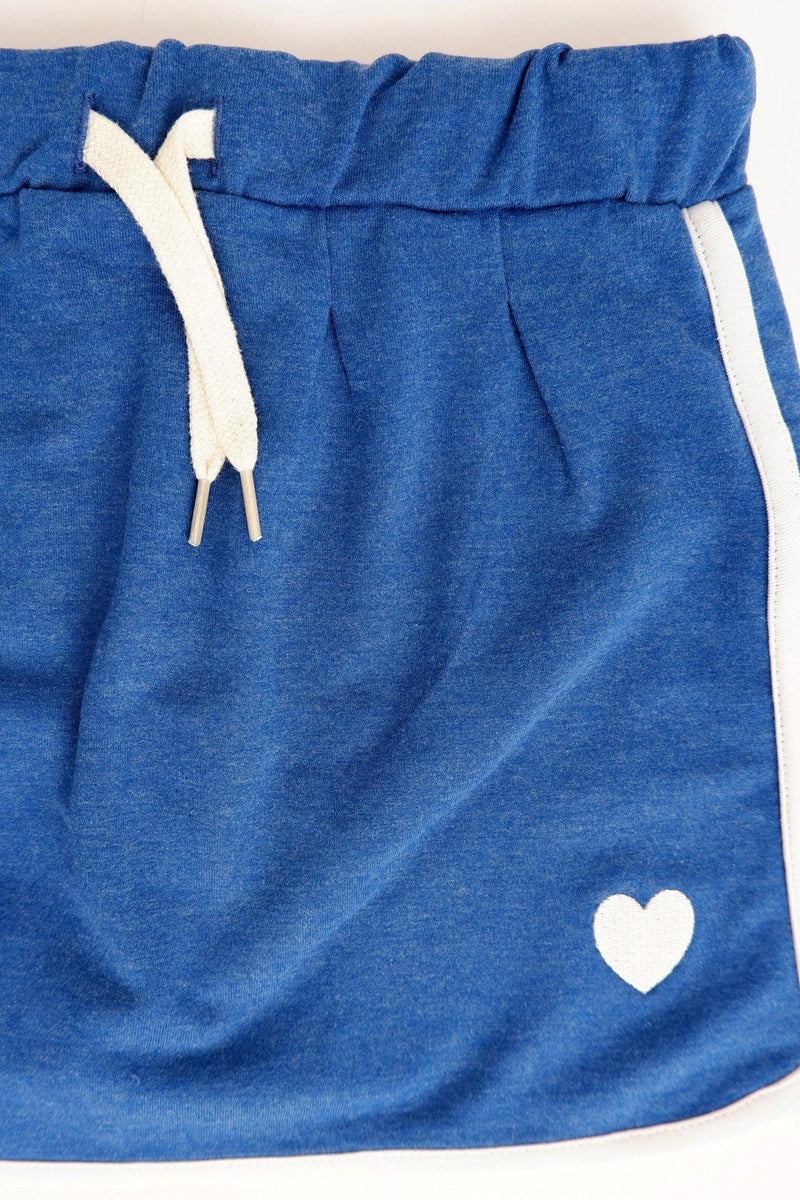 Laden Sie das Bild in Galerie -Viewer, Front detail of Blue jersey skirt in organic cotton for girls
