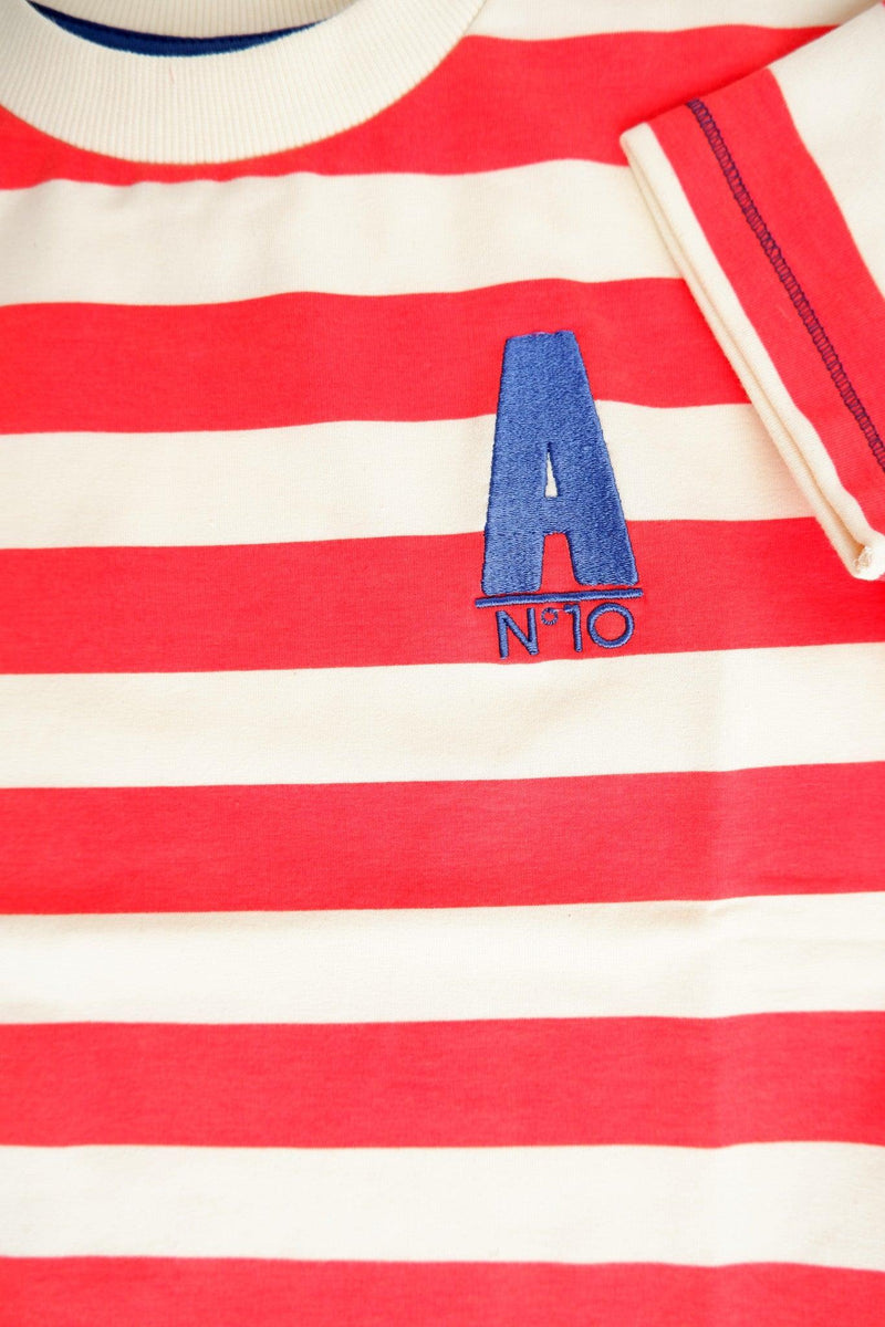 Load image into Gallery viewer, CHest detail of Organic t-shirt in red breton stripe for children by albaofdenmark
