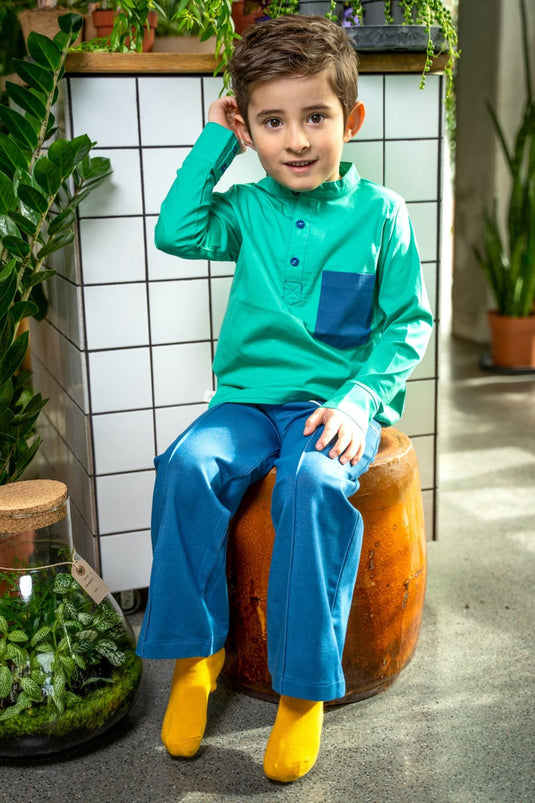 Boy wearing bell bottom pants in organic blue jeans fabric