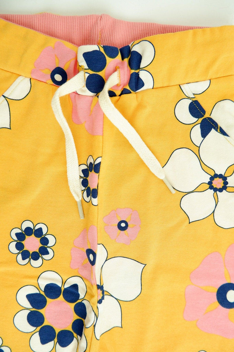 Load image into Gallery viewer, front detail of Lucca baby pants in yellow organic cotton
