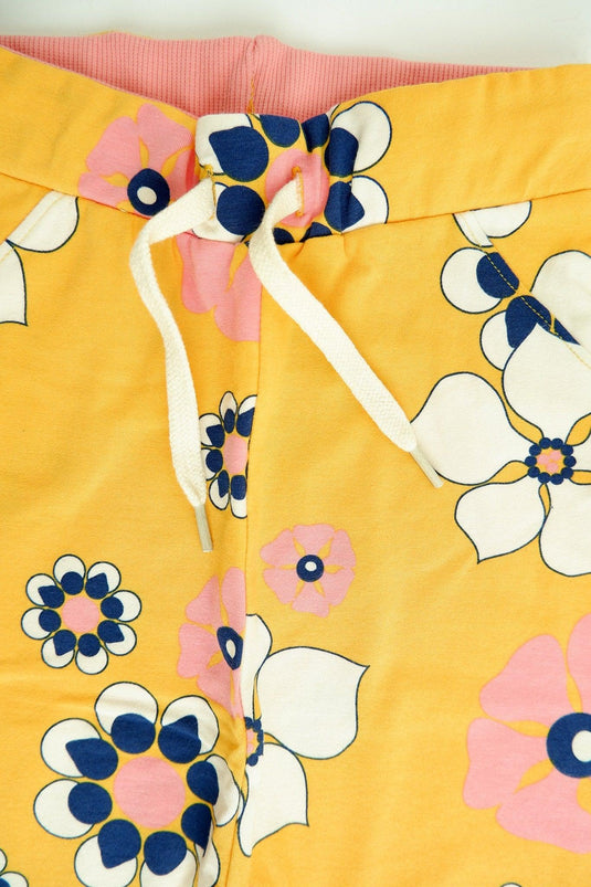 front detail of Lucca baby pants in yellow organic cotton