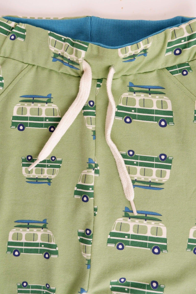 Laden Sie das Bild in Galerie -Viewer, Waist detail of Lucca baby pants in soft green organic cotton
